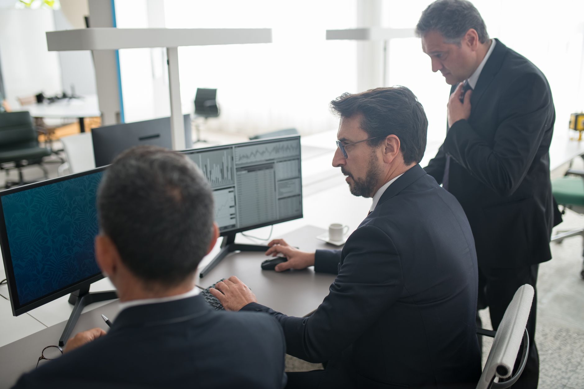 men using computer in a office